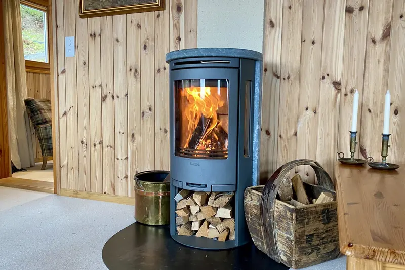 The fire is lit, the logs stacked ready