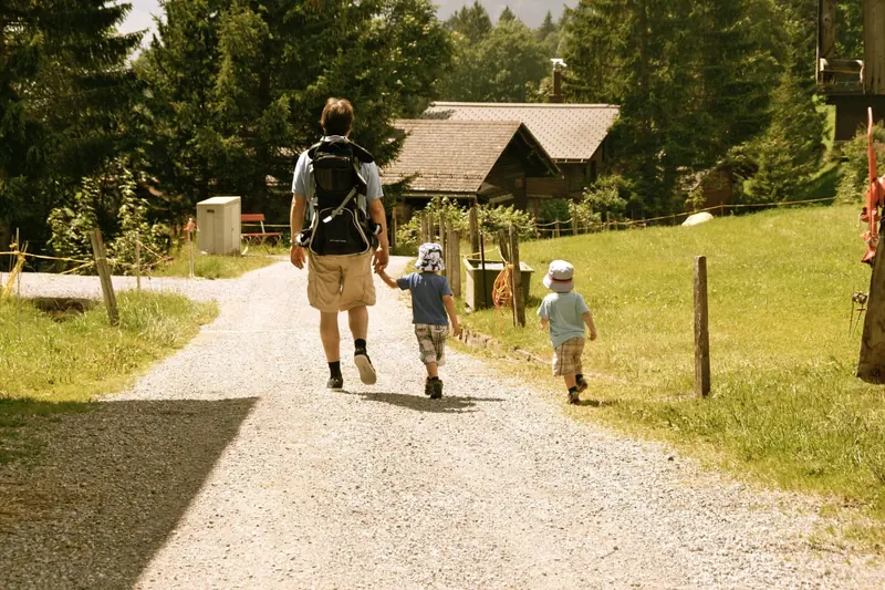 Hand in hand along a wide gravel path