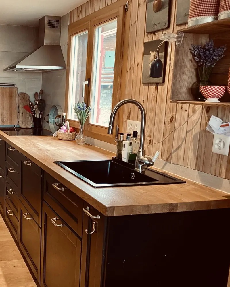The kitchen: wooden worktop, sink and window