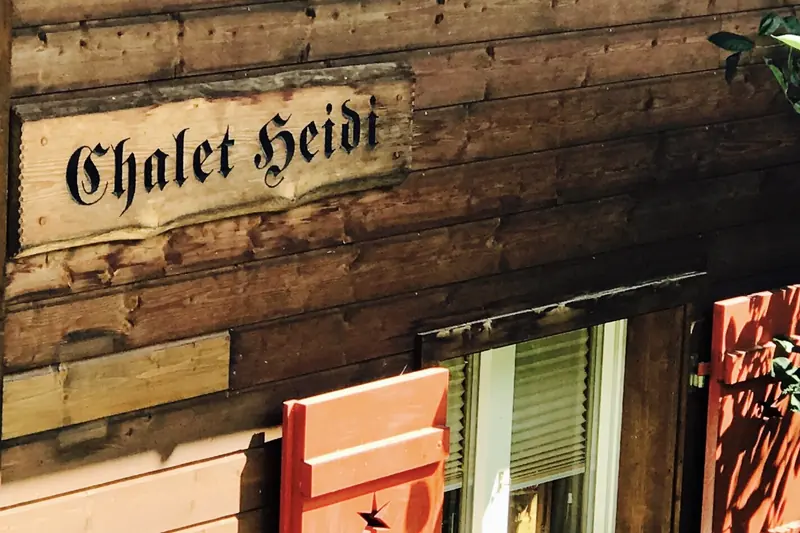 The Chalet Heidi name board on the wooden facade