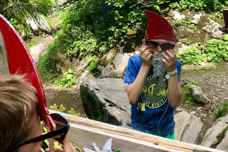 In a red pointed cap among the rocks